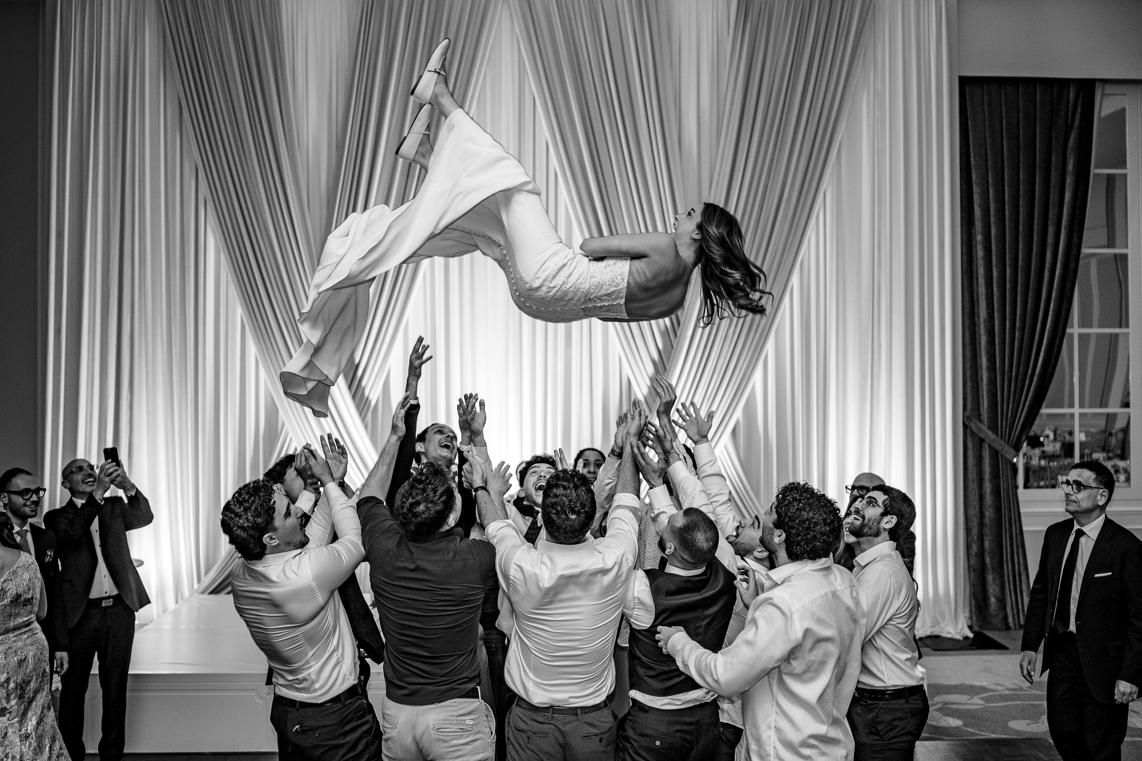 Catherine being thrown in the air